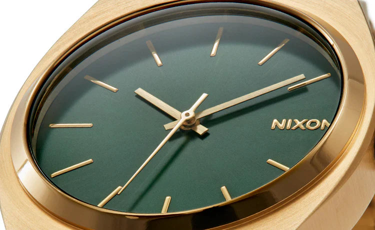 Gold Nixon Time Teller watch dial