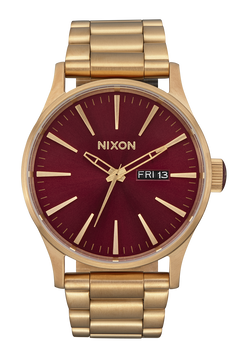 Nixon gold watch red face discount